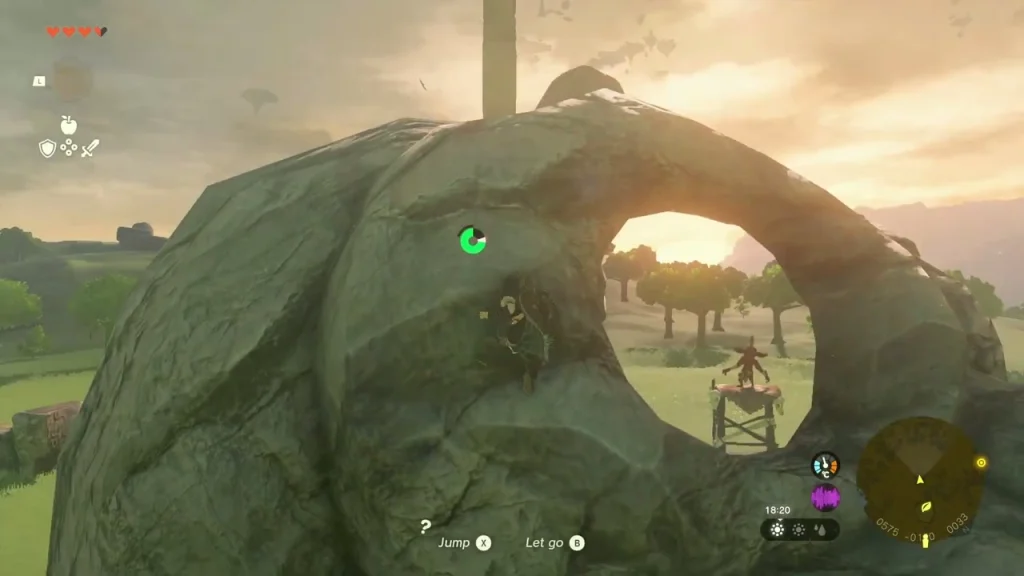 Giant boulder with a hole through it sheltering a Bokoblin camp Giant boulder with a hole through it sheltering a Bokoblin camp