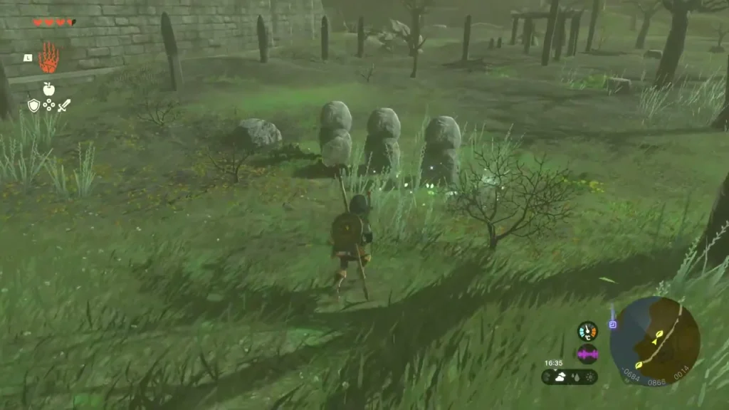 Row of rounded stone statues in the grass beside Castle Town Prison Row of rounded stone statues in the grass beside Castle Town Prison
