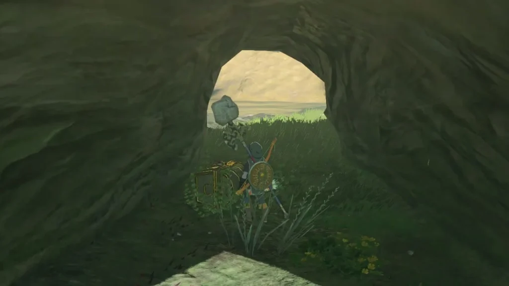 Chest lowered to the ground beneath the rock arch, ready to open Chest lowered to the ground beneath the rock arch, ready to open