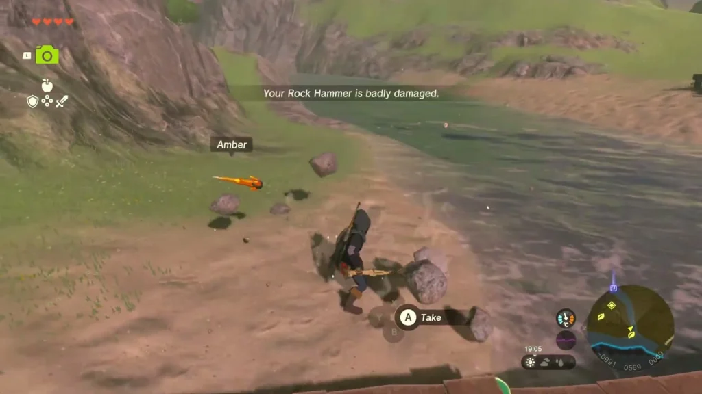 Ore deposit on the sandbar smashed open with a piece of Amber lying on the sand Ore deposit on the sandbar smashed open with a piece of Amber lying on the sand