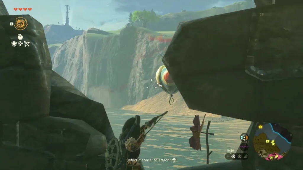 Last balloon floating beside a boulder, being aimed at Last balloon floating beside a boulder, being aimed at