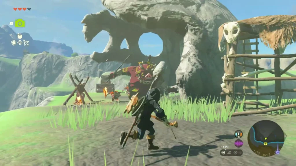 Boss Bokoblin standing under the rock arch of the camp Boss Bokoblin standing under the rock arch of the camp