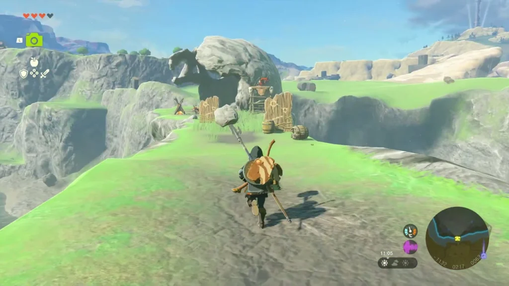 Boss Bokoblin camp of bone towers and fire pits beneath a rock arch Boss Bokoblin camp of bone towers and fire pits beneath a rock arch