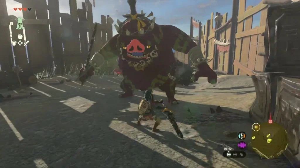 Boss Bokoblin charging across the courtyard inside the fort palisade Boss Bokoblin charging across the courtyard inside the fort palisade