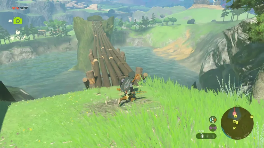 Lashed-log structure at the water's edge with a grassy bank beside it Lashed-log structure at the water's edge with a grassy bank beside it