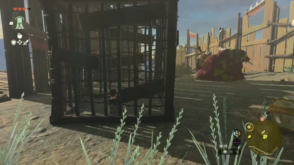 Wooden cage in the fort courtyard with a large Bokoblin resting behind it Wooden cage in the fort courtyard with a large Bokoblin resting behind it