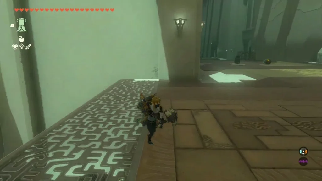 Maze-patterned floor and tall wall in the first room of the shrine