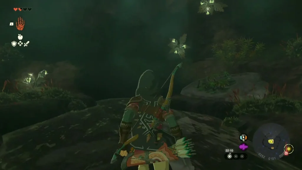 Chest glowing beyond the broken rocks in a mossy cave Chest glowing beyond the broken rocks in a mossy cave