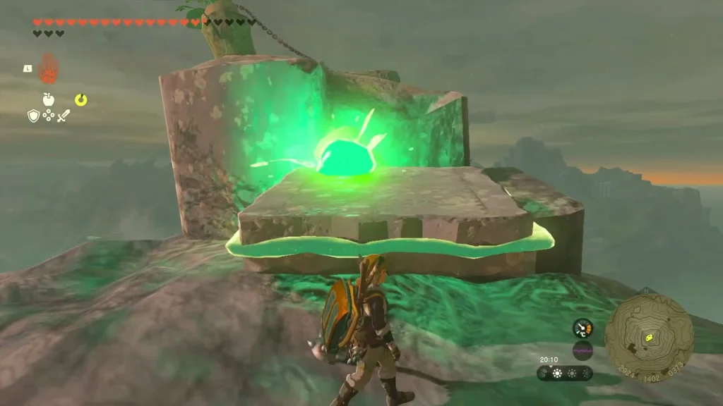Green glowing device on the rocky peak where the plug sits Green glowing device on the rocky peak where the plug sits