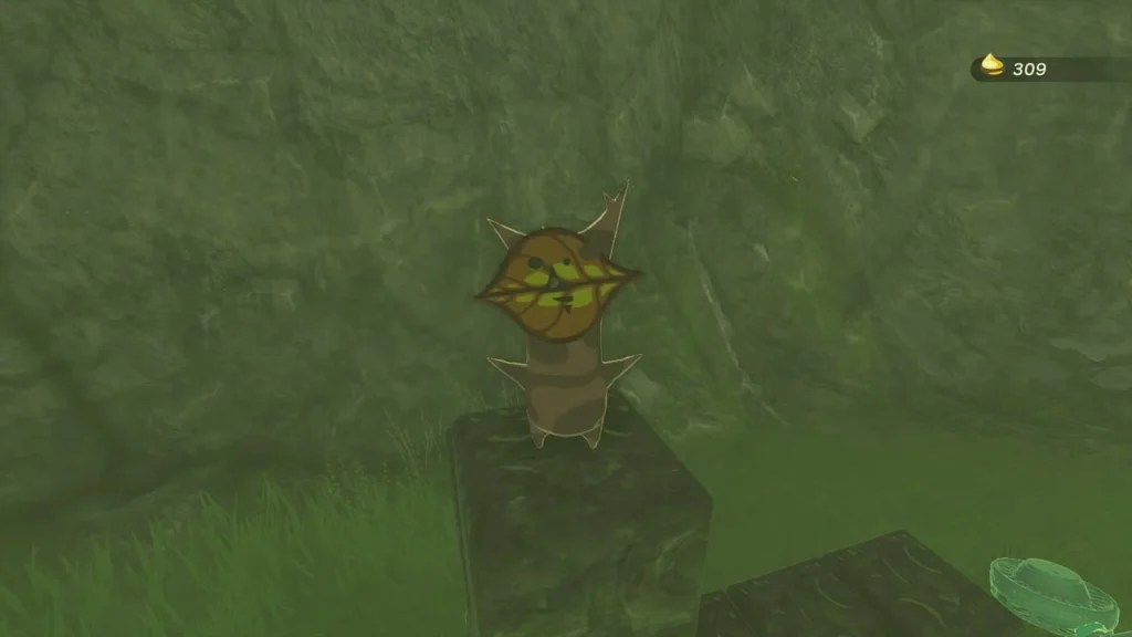 Korok sitting on a stone pedestal on the green plateau Korok sitting on a stone pedestal on the green plateau
