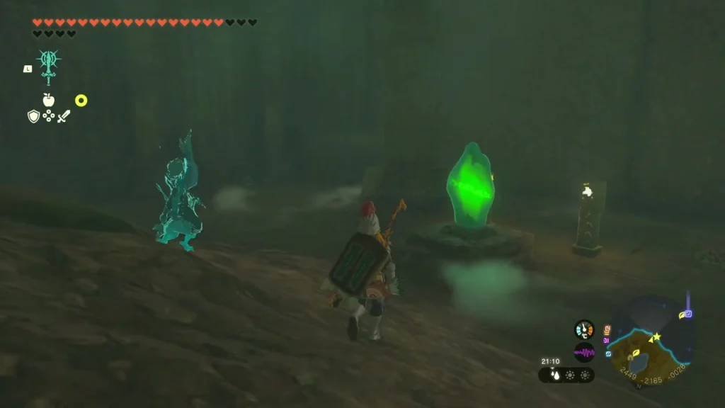 Glowing green crystal on a stone stand in a gloomy cave next to a lit lantern post Glowing green crystal on a stone stand in a gloomy cave next to a lit lantern post