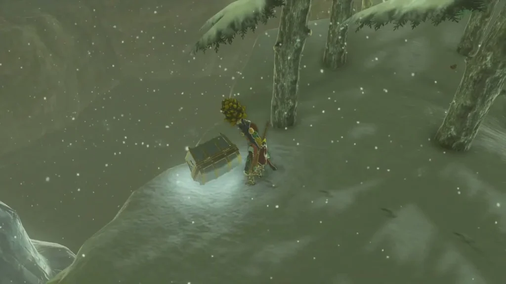 Glowing treasure chest sitting in the snow between pine trunks east of Rito Village Glowing treasure chest sitting in the snow between pine trunks east of Rito Village