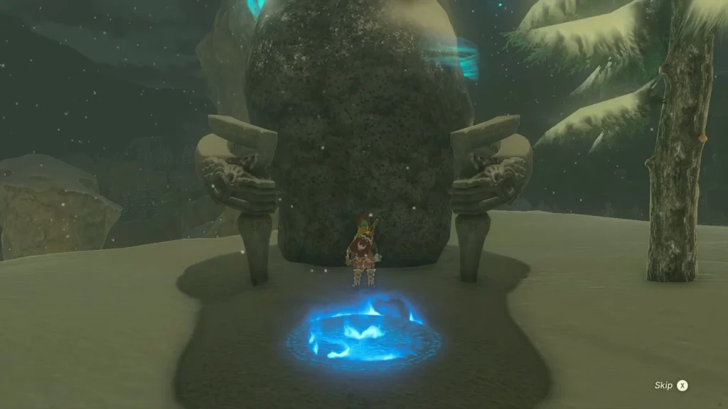Blue travel pad in front of the Gatakis Shrine doorway cut into a snowy rock face Blue travel pad in front of the Gatakis Shrine doorway cut into a snowy rock face