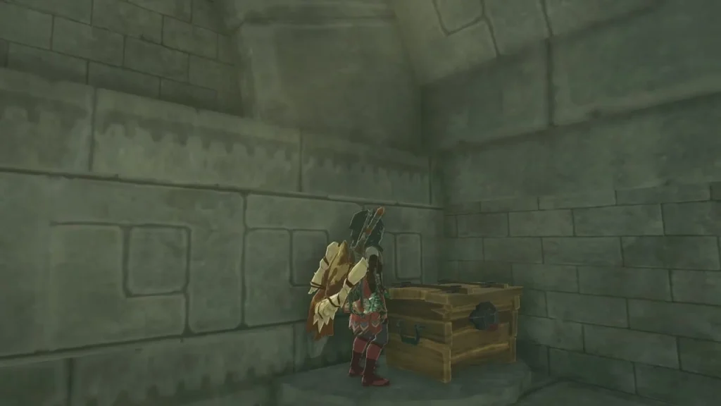 Closed wooden chest on the floor of a ruined stone chamber beside the Cliff Bargainer Statue Closed wooden chest on the floor of a ruined stone chamber beside the Cliff Bargainer Statue