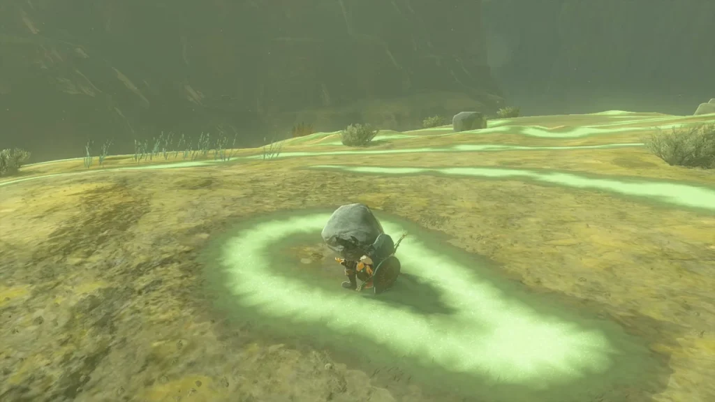 Pale rock sitting inside a loop of the geoglyph's glowing lines Pale rock sitting inside a loop of the geoglyph's glowing lines