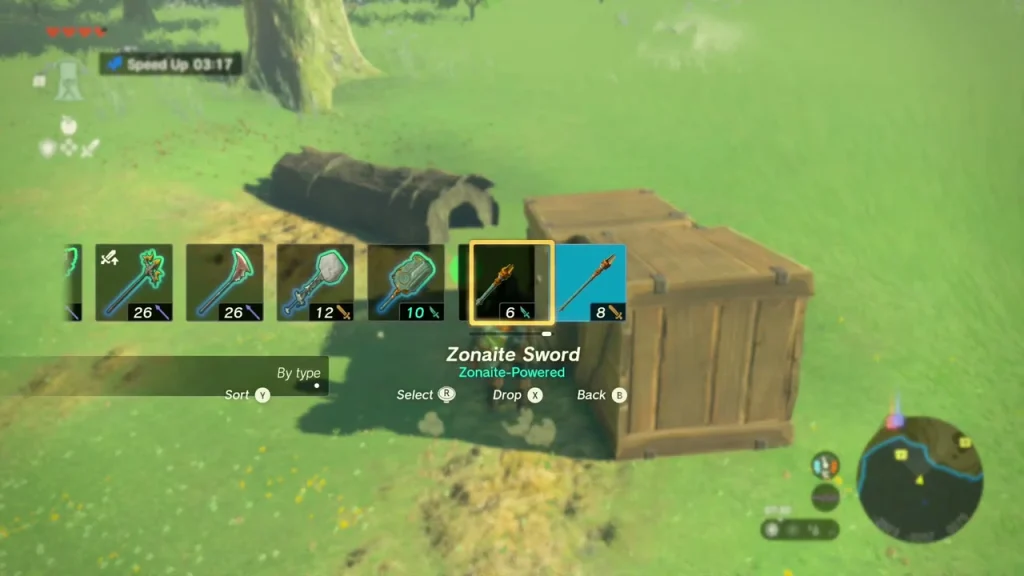 Open chest and wooden crate on the grass beside a hammer Open chest and wooden crate on the grass beside a hammer