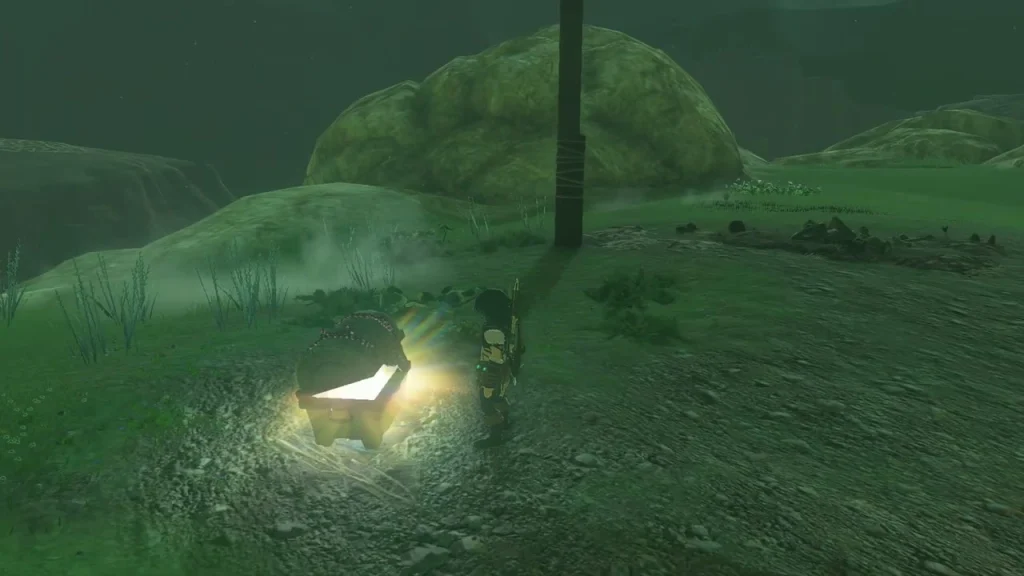 Glowing chest in a dark field beside a wooden post Glowing chest in a dark field beside a wooden post