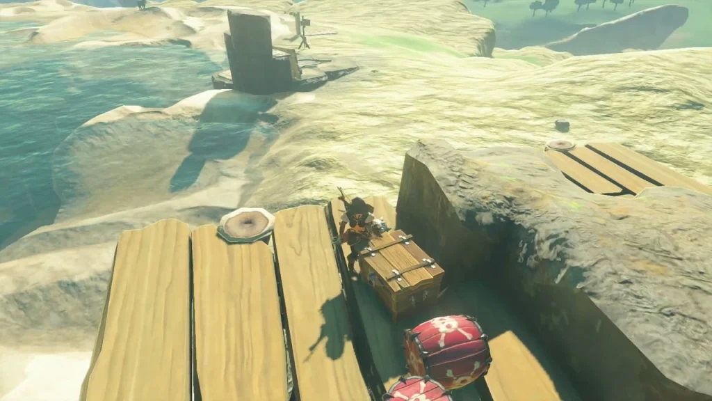 Chest at the lake edge giving Arrow x5 beside red barrels