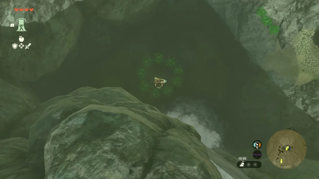 Ring of lily pads in the dark pool below the waterfall