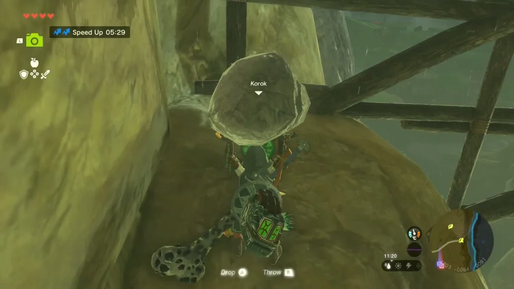 Loose rock lifted overhead under the bridge beside a Korok