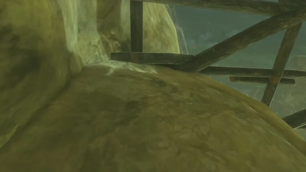 Timber supports under Jeddo Bridge and a rounded boulder