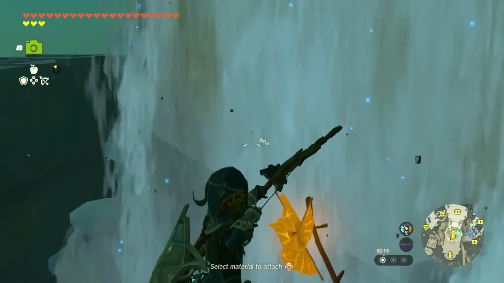 Bow drawn at a balloon hanging beside the waterfall Bow drawn at a balloon hanging beside the waterfall