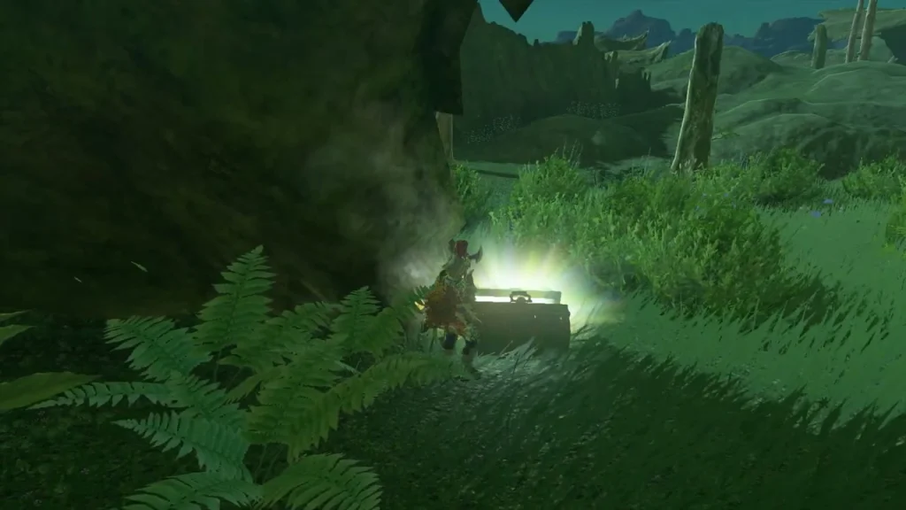 Chest glowing among ferns beside a dark road Chest glowing among ferns beside a dark road