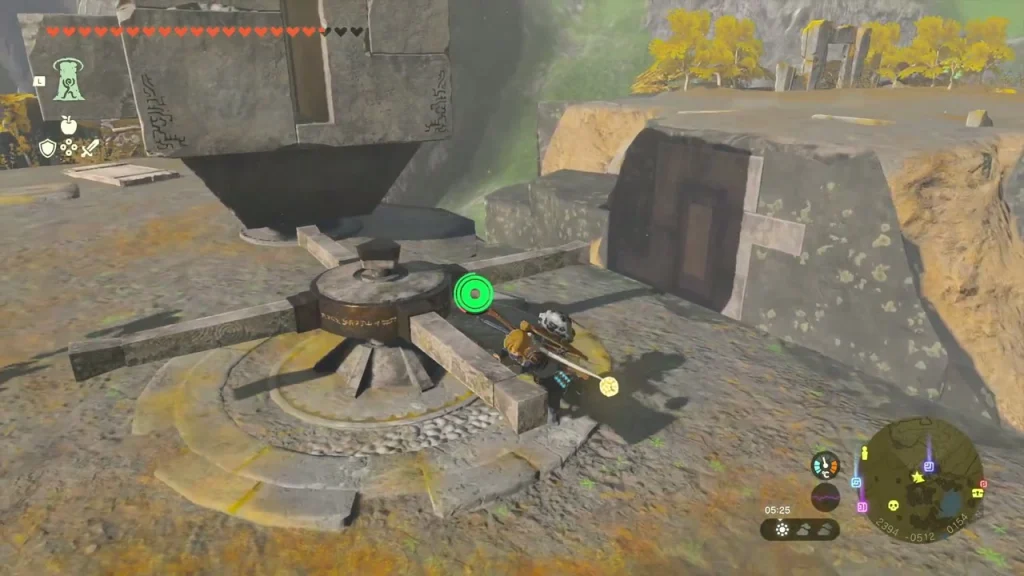 Stone rotating mechanism on the ruin top with the white symbol wall behind it Stone rotating mechanism on the ruin top with the white symbol wall behind it