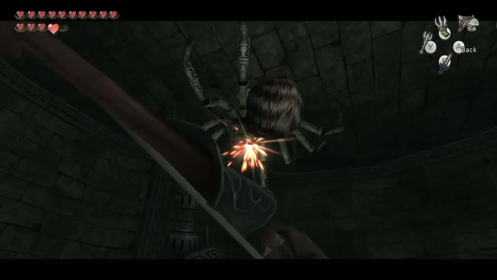 Link's arrow striking Armogohma as it hangs from the ceiling Link's arrow striking Armogohma as it hangs from the ceiling