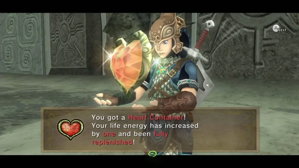 Link holding up a Heart Container with its item name message box Link holding up a Heart Container with its item name message box