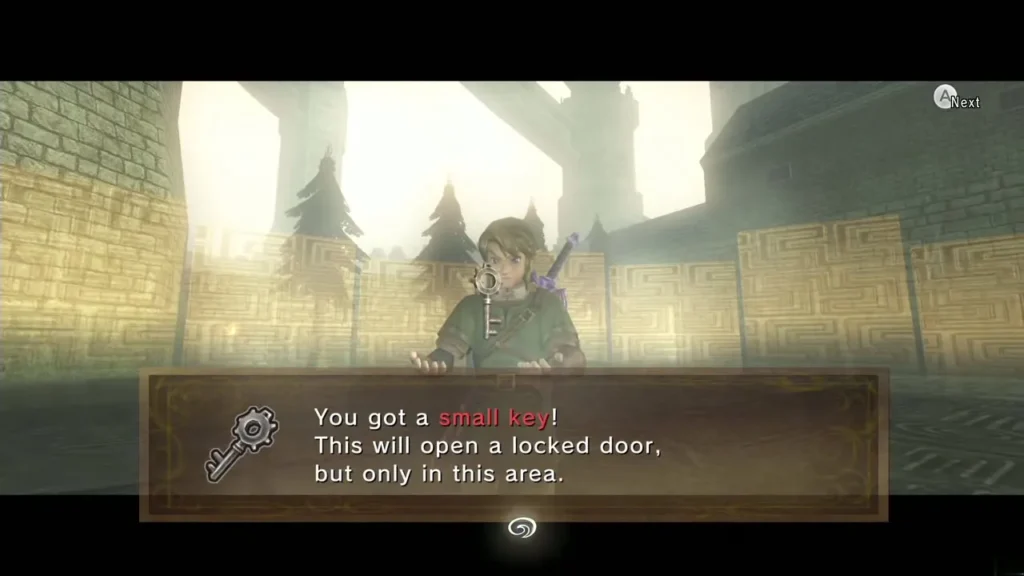 Link holding up a small key with the message box naming it Link holding up a small key with the message box naming it