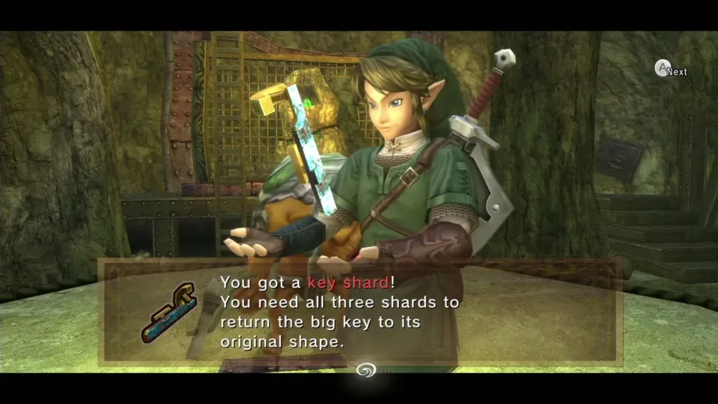 Link holding the Key Shard with the message box in the Goron Mines Link holding the Key Shard with the message box in the Goron Mines