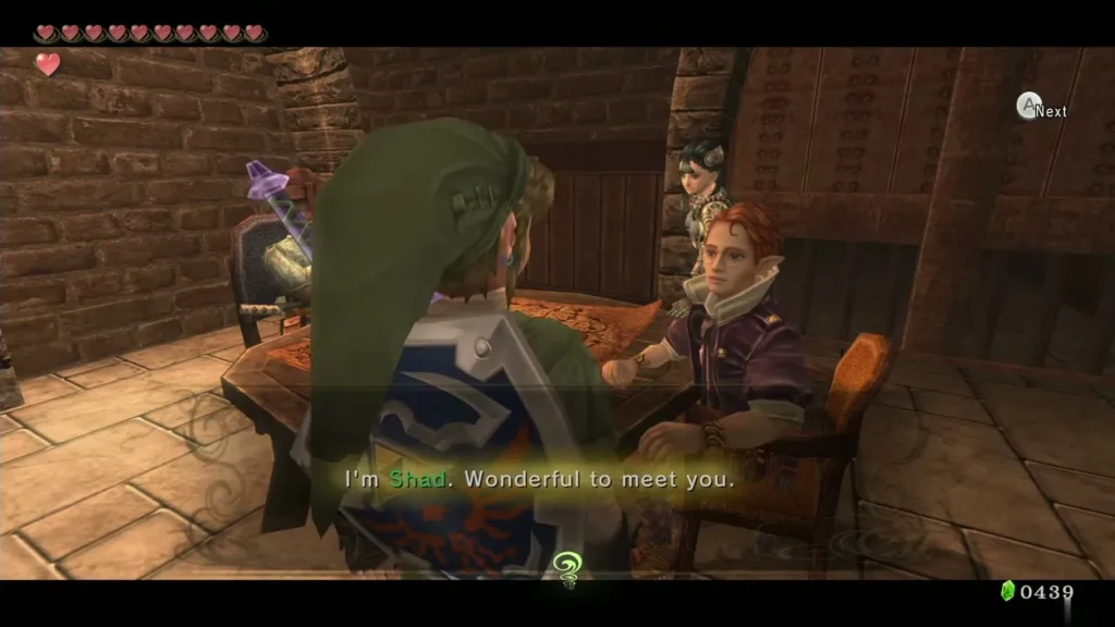 Shad in a purple coat seated across a table from Link in Telma's Bar Shad in a purple coat seated across a table from Link in Telma's Bar