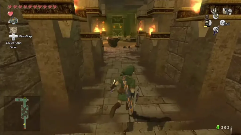 Link walking down a torch-lit corridor into Arbiter's Grounds Link walking down a torch-lit corridor into Arbiter's Grounds