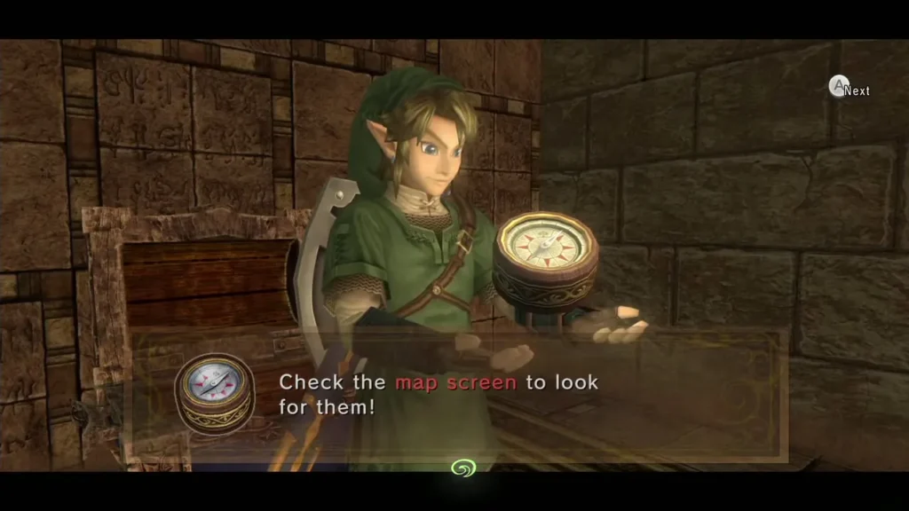Link holding up the Compass beside an open chest, with the item message box Link holding up the Compass beside an open chest, with the item message box