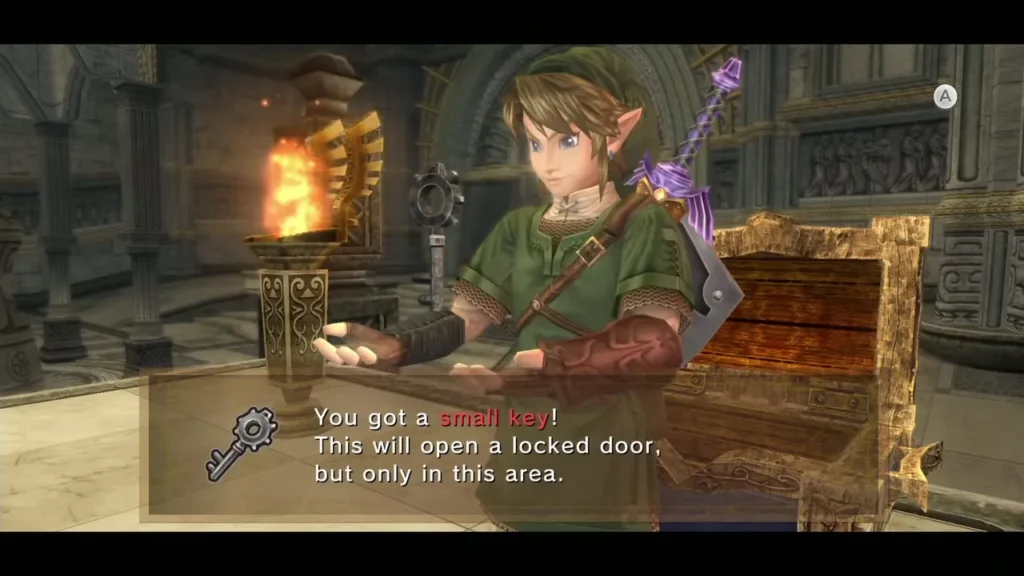 Link holding up a small key with its message box beside a lit torch Link holding up a small key with its message box beside a lit torch