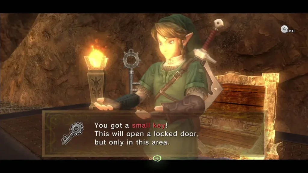 Link holding up a Small Key beside a torch with its message box in the Goron Mines Link holding up a Small Key beside a torch with its message box in the Goron Mines