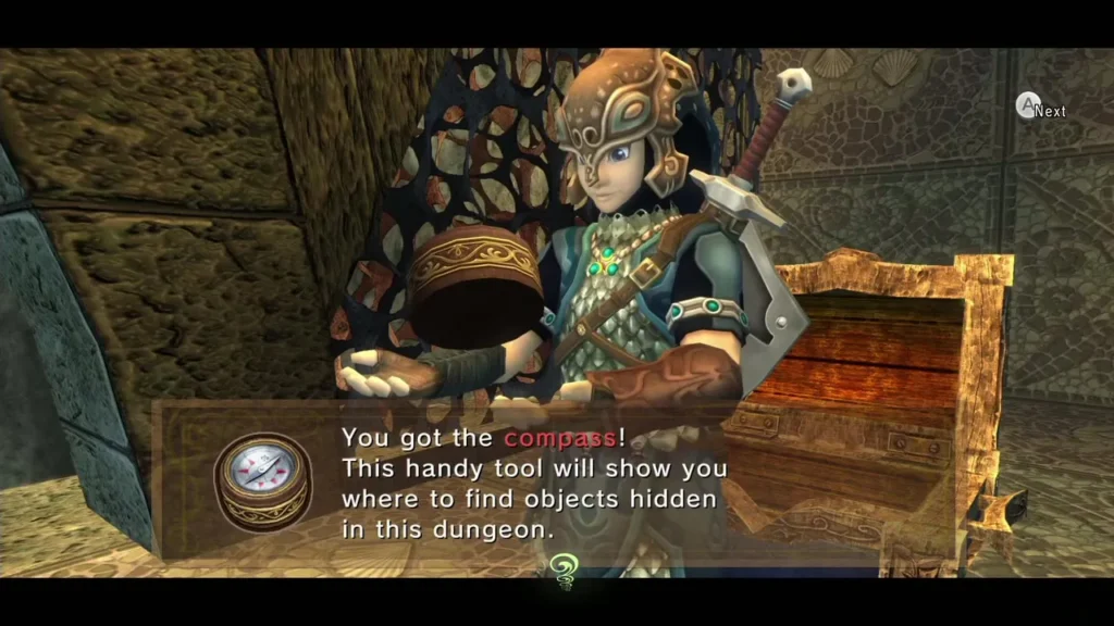 Link holding up the Compass with its message box in the Lakebed Temple Link holding up the Compass with its message box in the Lakebed Temple