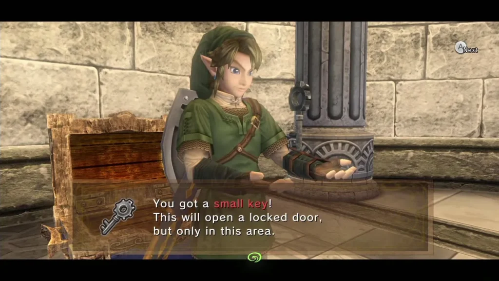 Link holding up a small key with its message box beside a stone column Link holding up a small key with its message box beside a stone column