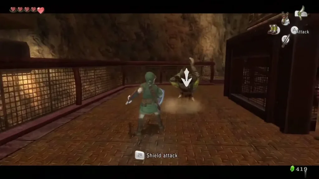Link facing a Bulblin on a grated walkway, with the shield attack prompt on screen Link facing a Bulblin on a grated walkway, with the shield attack prompt on screen