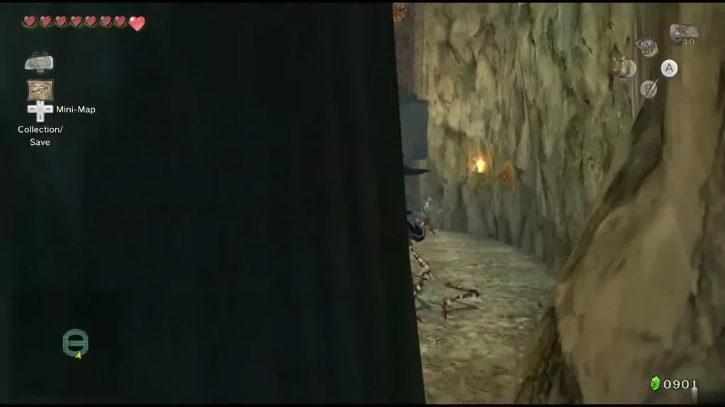 Link sword-slashing a one-eyed jumper beside a cave wall in Lakebed Temple Link sword-slashing a one-eyed jumper beside a cave wall in Lakebed Temple
