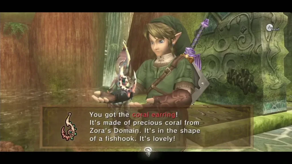 Link holding up the coral earring with its item message box Link holding up the coral earring with its item message box