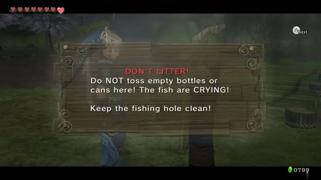 Wooden dock sign reading Don't Litter and keep the fishing hole clean Wooden dock sign reading Don't Litter and keep the fishing hole clean