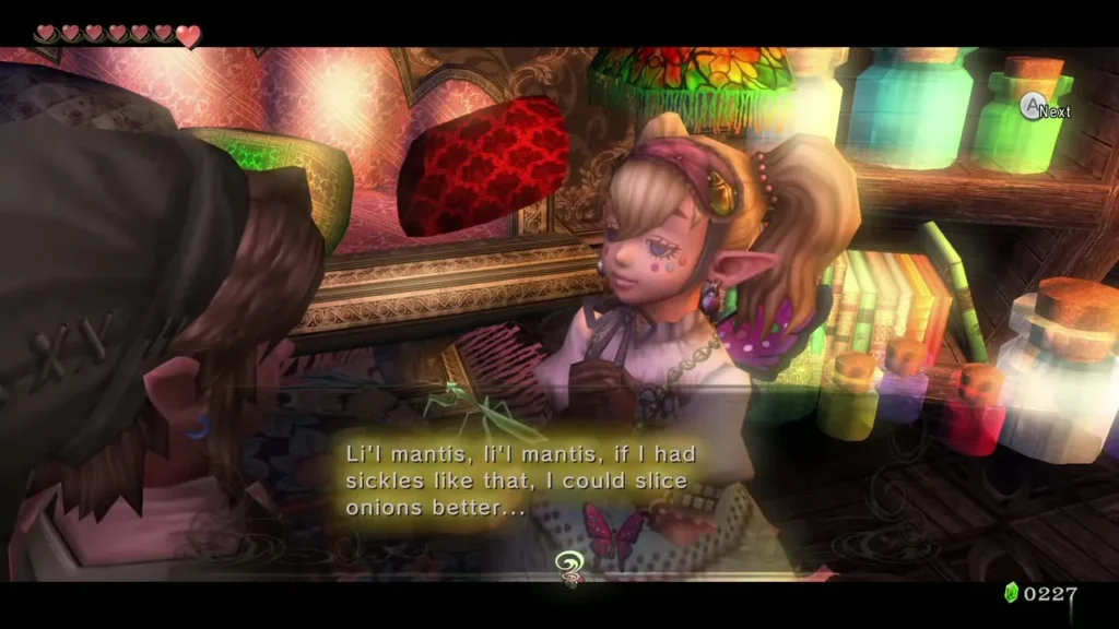 Agitha speaking to the golden mantis held in front of her