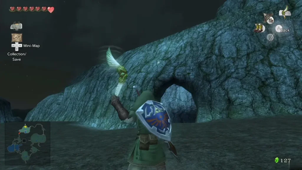Link sending the Gale Boomerang up at the rock wall in Hyrule Field at night