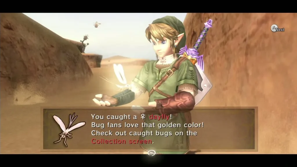 Link holding up a caught golden female dayfly under its catch message box in the Gerudo Desert