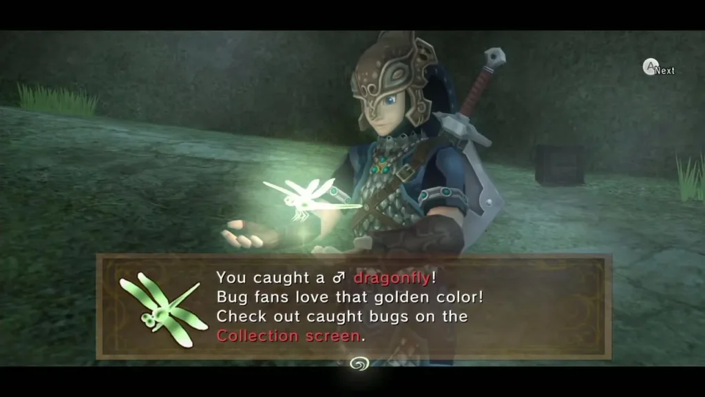 Link holding up a glowing golden male dragonfly over its catch message box in a grassy patch