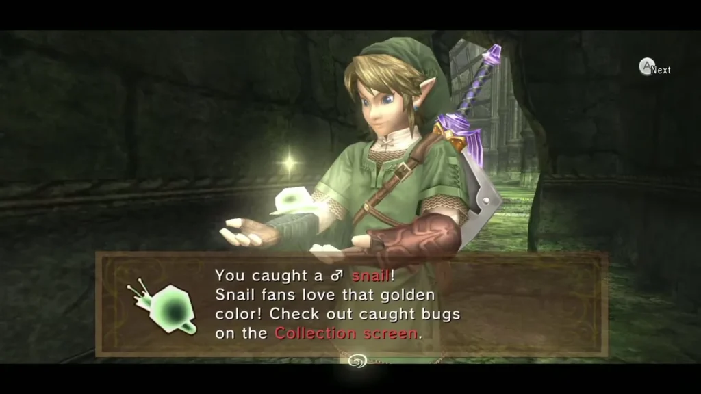 Link holding up a glowing golden male snail under its catch message box in a mossy stone ruin