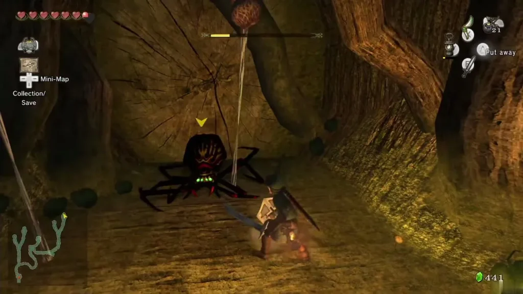 Link fighting a Skulltula hanging from its thread in the gorge cave Link fighting a Skulltula hanging from its thread in the gorge cave