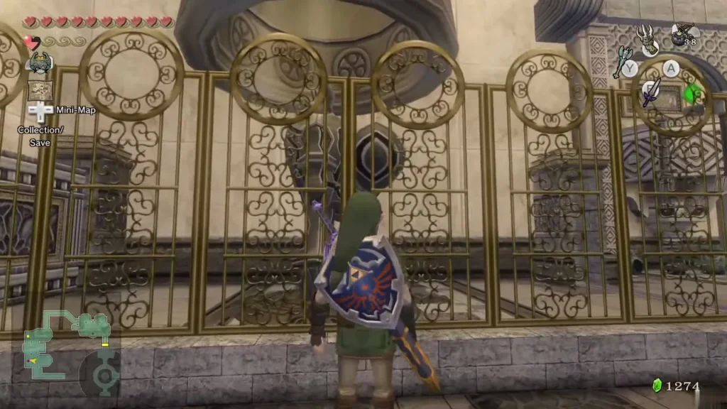 Link standing before the golden gate with a guardian statue behind the fence Link standing before the golden gate with a guardian statue behind the fence